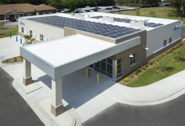 External photo of the Net-Zero center showing solar panels on the roof